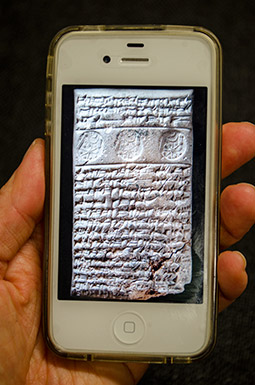 A cuneiform tablet displayed on an iPhone